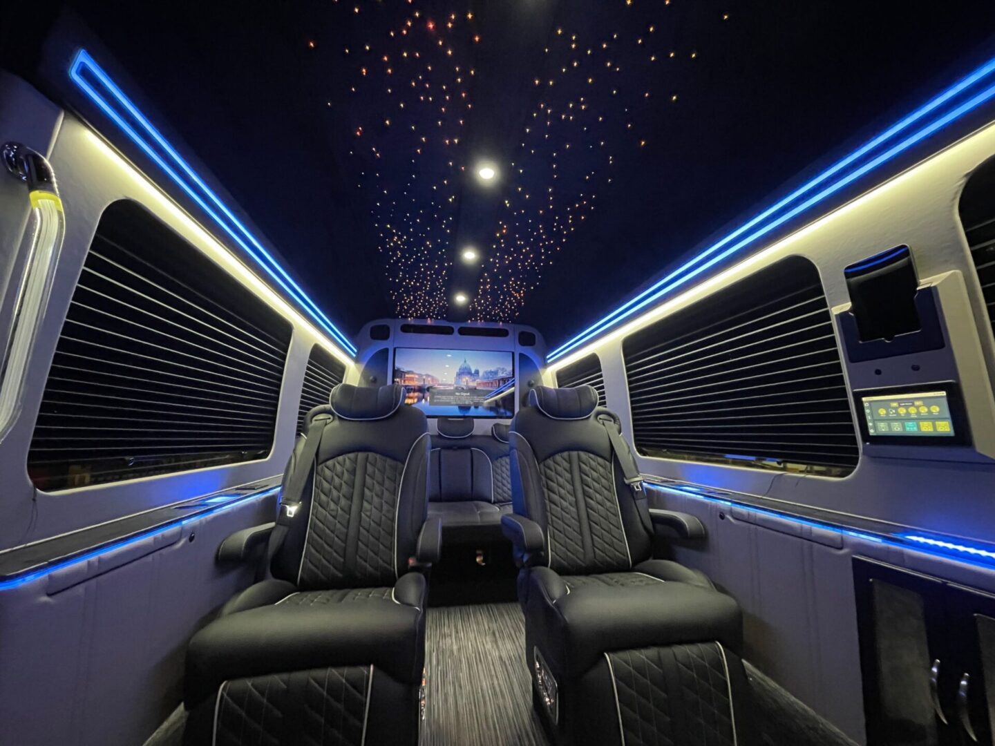 A view of the back seats in a limo.