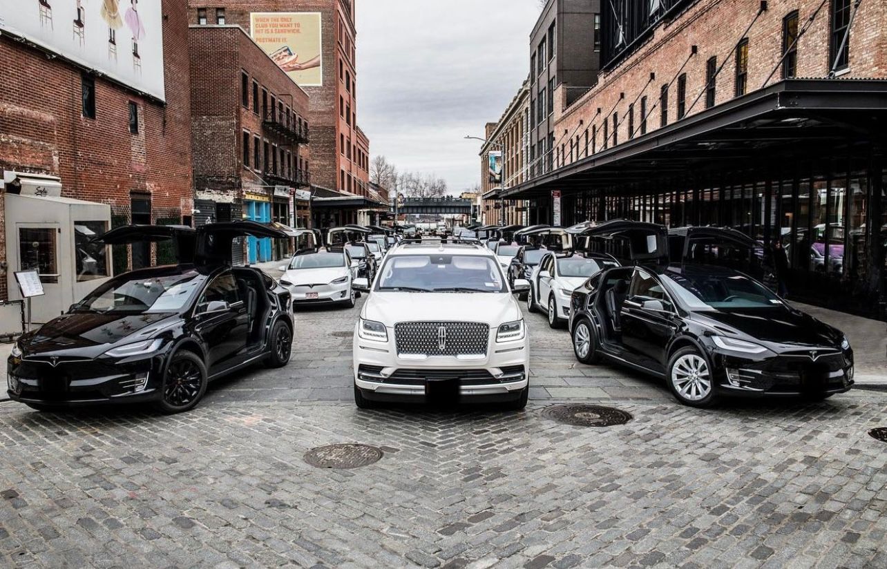 A bunch of cars parked on the side of a road