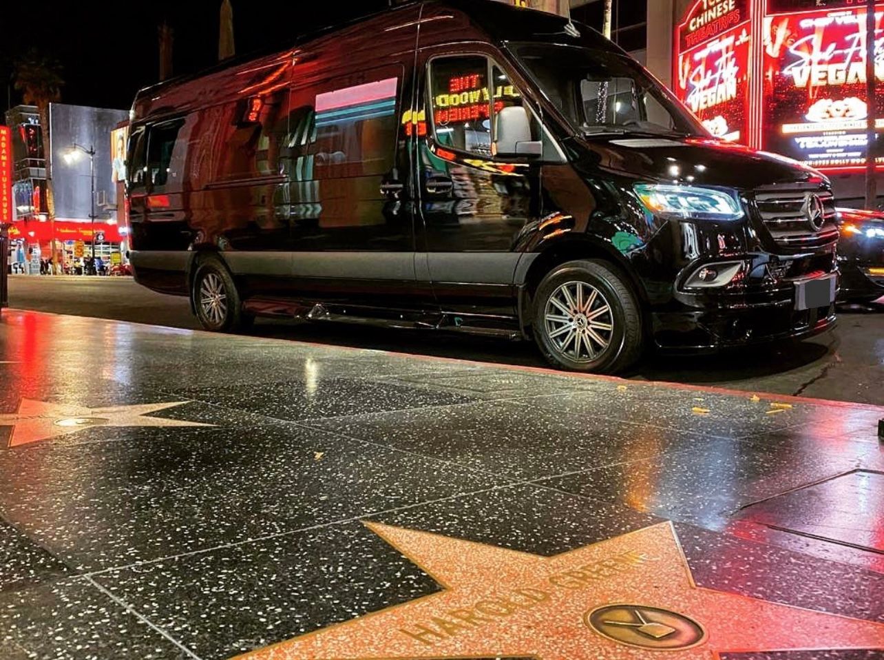 A van parked on the side of a street.