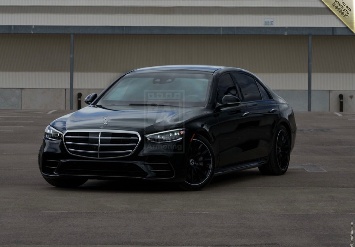 A black car parked in front of a building.