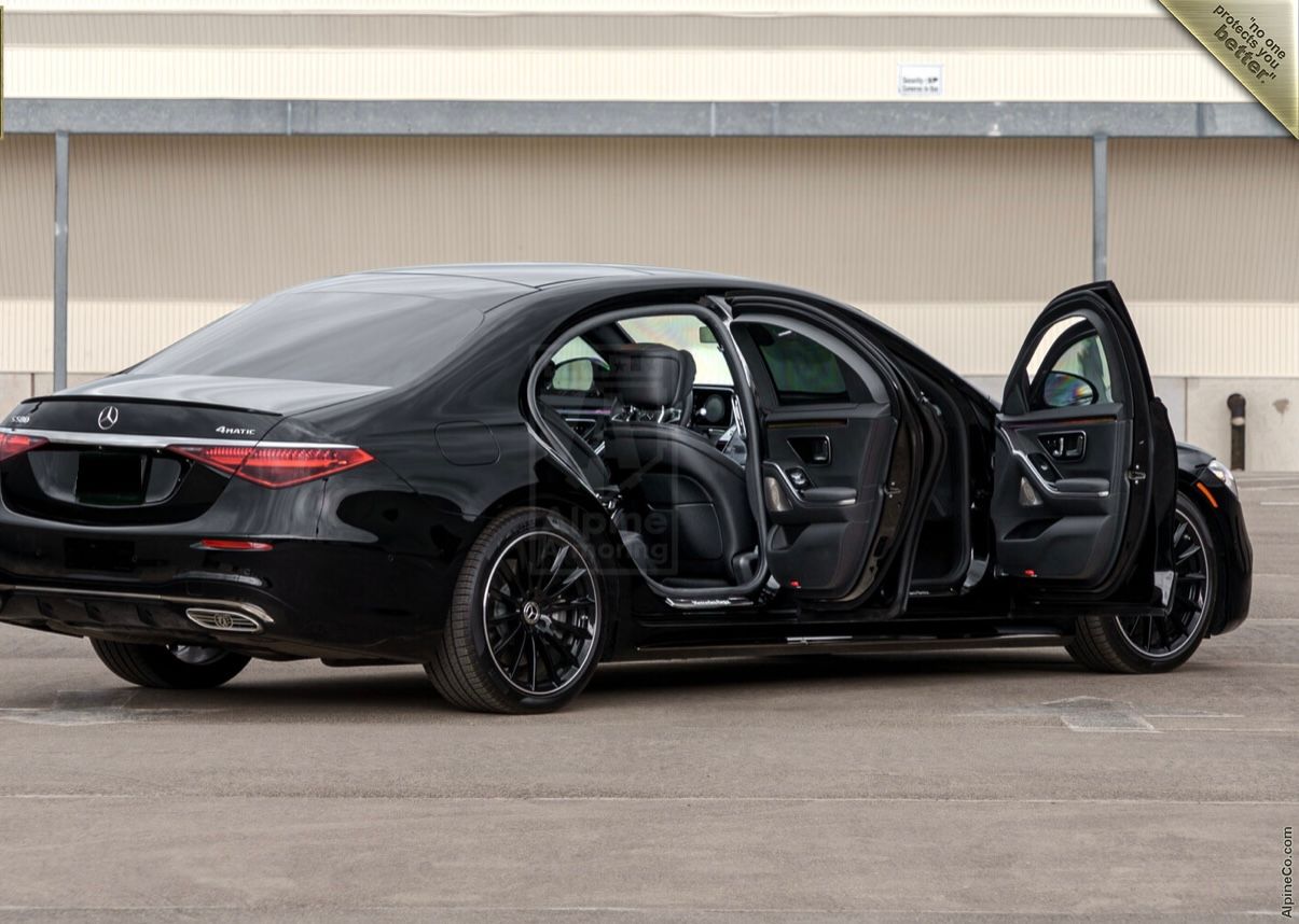 A black car with its doors open and the door opened.