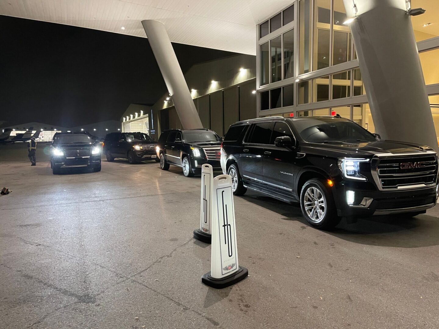 A bunch of cars parked in front of some buildings